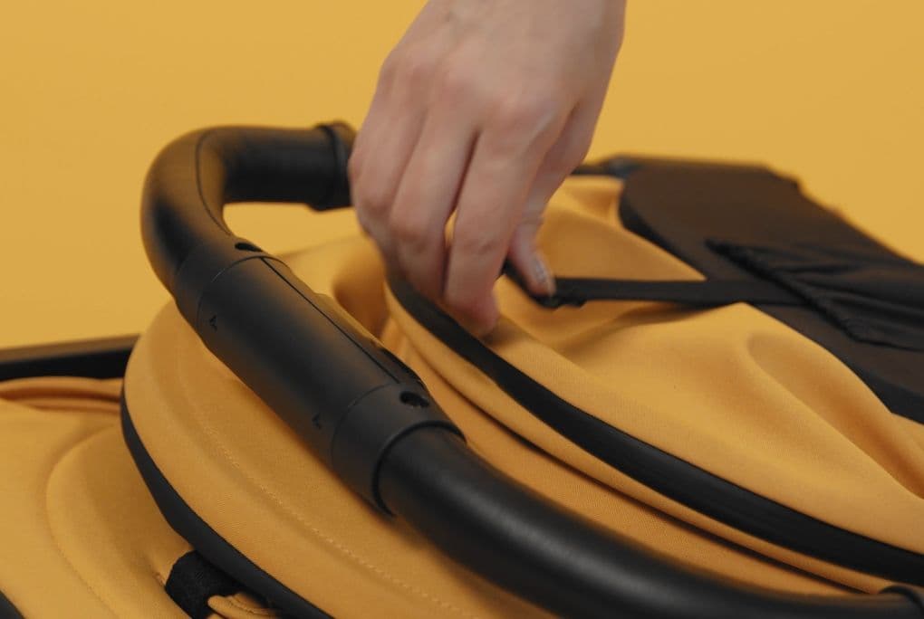 Unfolding the stroller with one hand